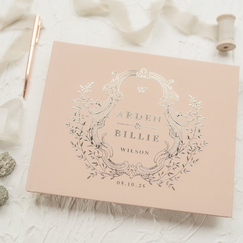 Elegant Wedding Guest Book with Ornate Crest Design