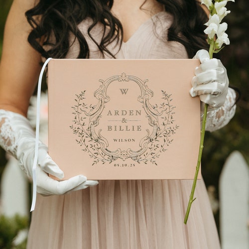 Elegant Wedding Guest Book with Ornate Crest Design